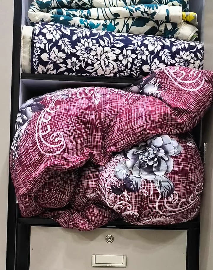 Before — razai filling the shelf