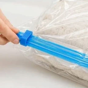 Step 2 — slide the clip to seal the zip