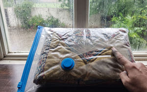 Sealed Larova vacuum bag protecting clothes from damp, dust and insects during monsoon